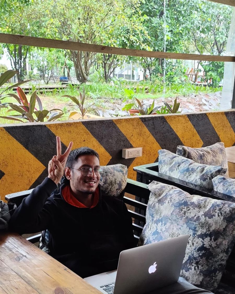 Satyam Chourey at a cafe table with his laptop